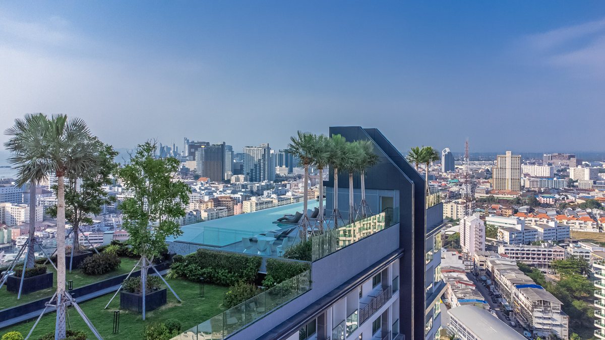 Aerial view of Arcadia Millennium Tower and its rooftop pool above Pattaya