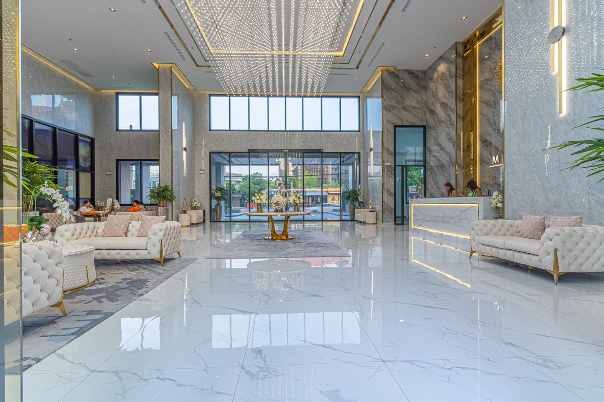 Hotel-style lobby of Arcadia Millennium Tower with marble floors